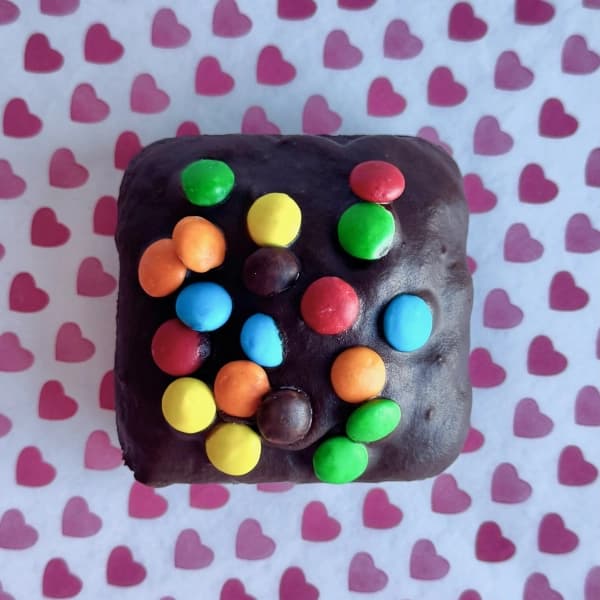Cosmic Brownies - fudgy chocolate brownie topped with chocolate icing and colorful candy chips