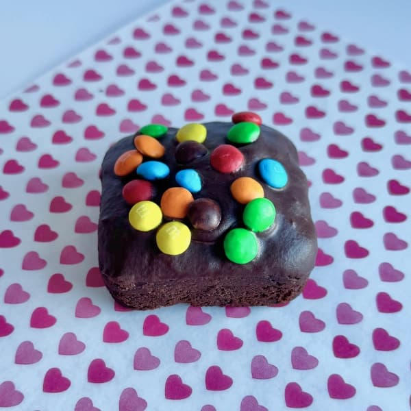 Cosmic Brownies - fudgy chocolate brownie topped with chocolate icing and colorful candy chips