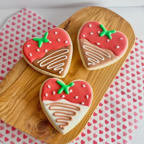 Three chocolate covered strawberries decorated sugar cookies